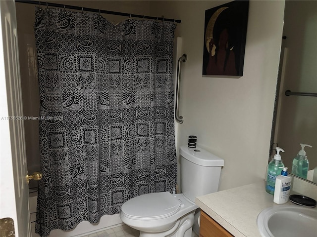 bathroom with toilet and vanity