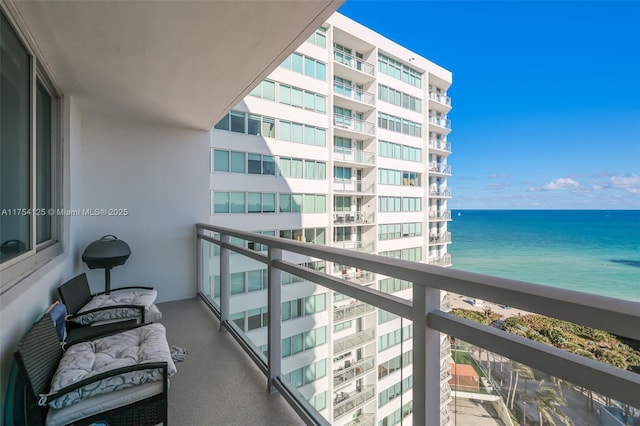 balcony featuring a water view