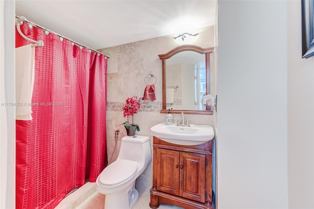 full bath featuring tile walls, curtained shower, vanity, and toilet