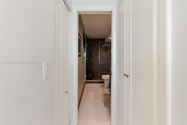 hall featuring light tile patterned floors