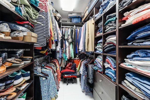 spacious closet featuring tile patterned flooring