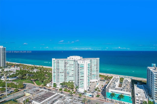 aerial view featuring a water view, a view of city, and a view of the beach