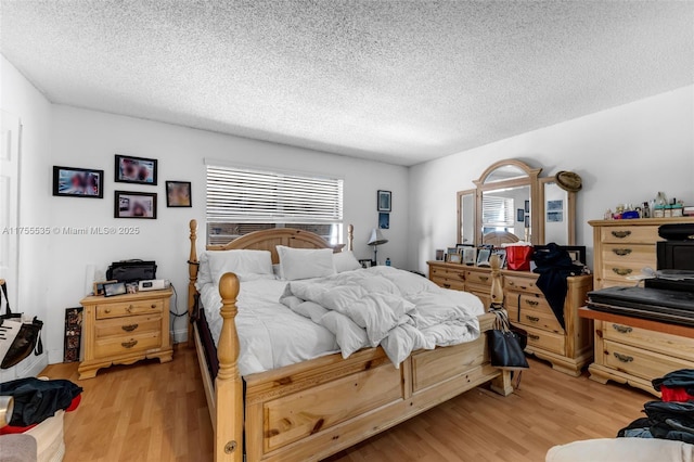 13190 SW 10th Terrace Dr Unit 13190, Miami, FL 33184 - bedroom featuring light wood-type flooring and a textured ceiling