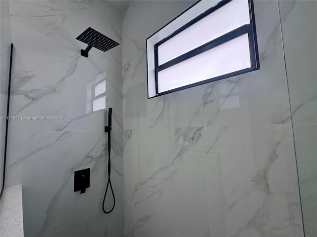 full bath featuring a marble finish shower