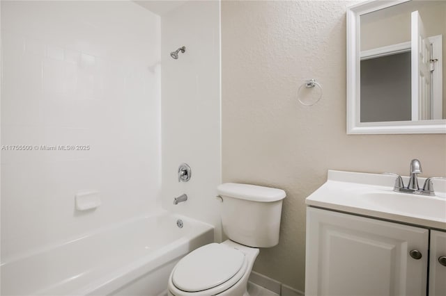 bathroom featuring toilet, bathtub / shower combination, and vanity