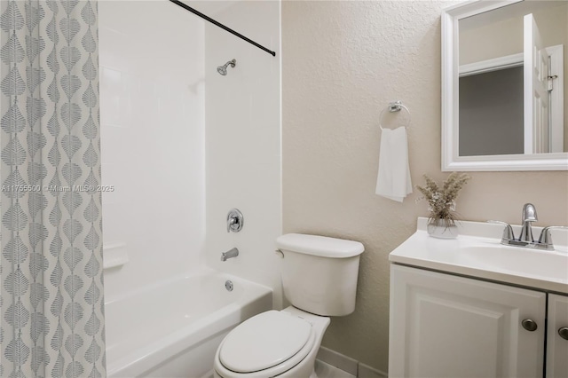 bathroom with a textured wall, vanity, toilet, and shower / tub combo with curtain