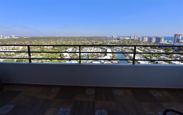 balcony with a view of city and a water view