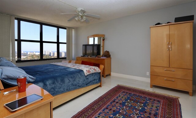 bedroom with marble finish floor and baseboards