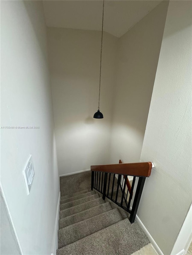 staircase with carpet and baseboards