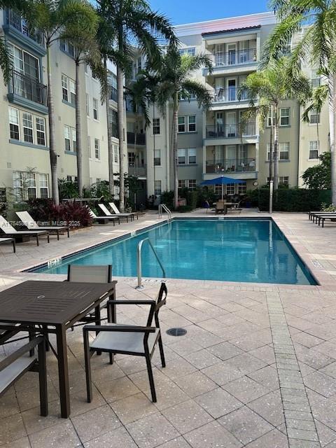 community pool featuring a patio area