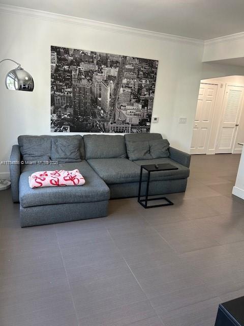 living room featuring crown molding