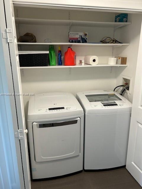 clothes washing area featuring laundry area and separate washer and dryer