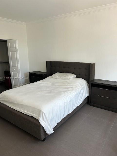 bedroom with ornamental molding