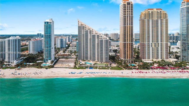 property's view of city with a water view and a view of the beach