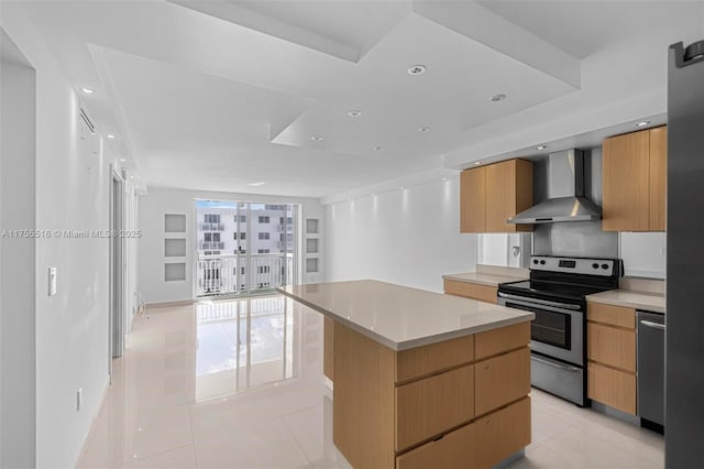 kitchen featuring light tile patterned floors, wall chimney exhaust hood, modern cabinets, and stainless steel appliances