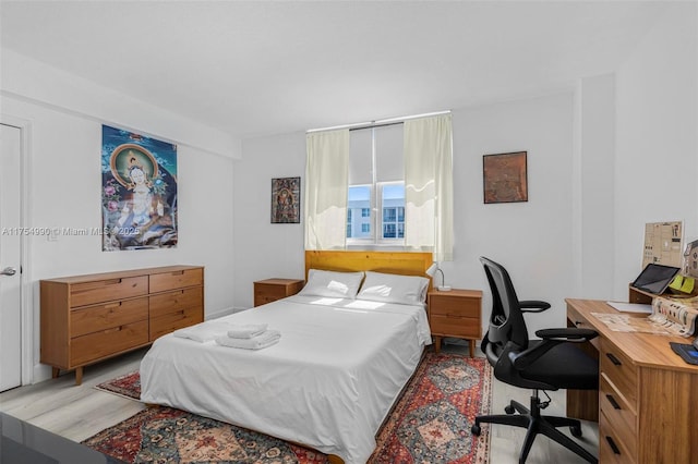 bedroom with light wood-type flooring