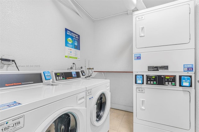 shared laundry area with light tile patterned floors, separate washer and dryer, and stacked washer / dryer