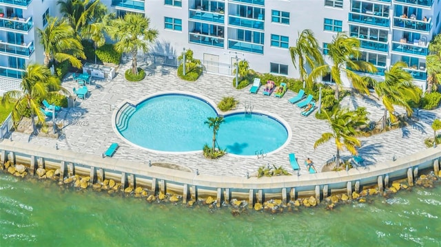 community pool featuring a patio area