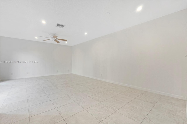 unfurnished room featuring a ceiling fan, recessed lighting, visible vents, and baseboards