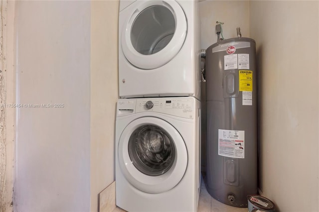 laundry room with stacked washer and dryer and water heater