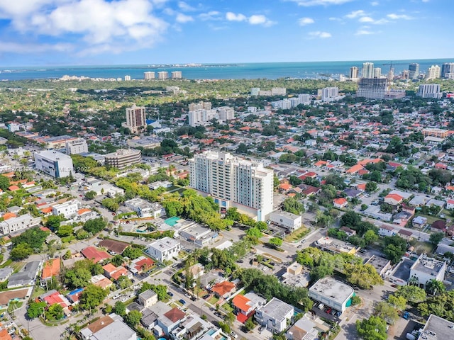 birds eye view of property with a view of city and a water view