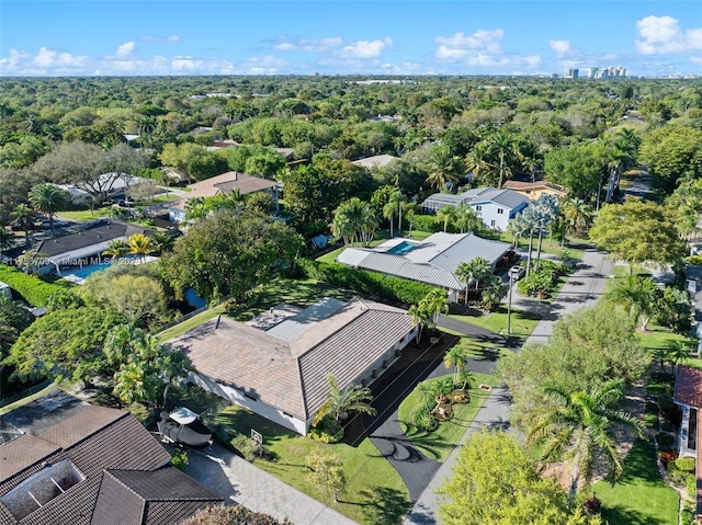 aerial view featuring a wooded view