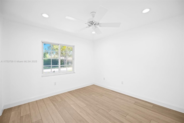 empty room with ceiling fan, light wood finished floors, recessed lighting, and baseboards