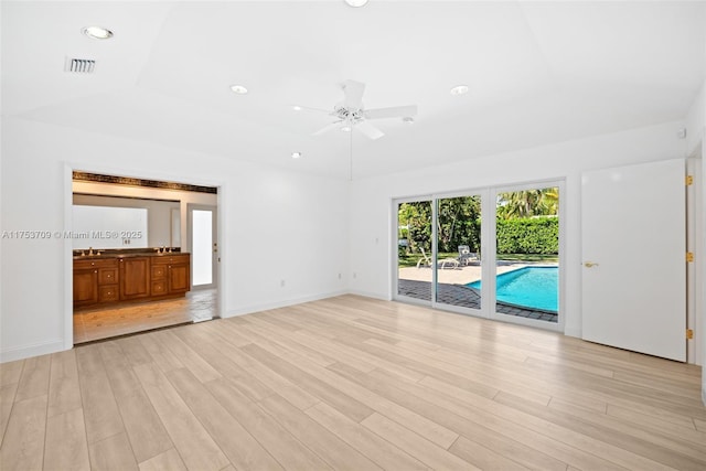 unfurnished living room with visible vents, baseboards, a ceiling fan, light wood-style flooring, and recessed lighting