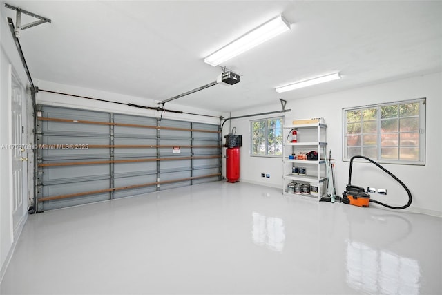 garage featuring a garage door opener