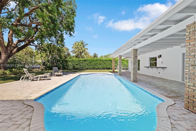 view of pool with a fenced in pool and a patio area