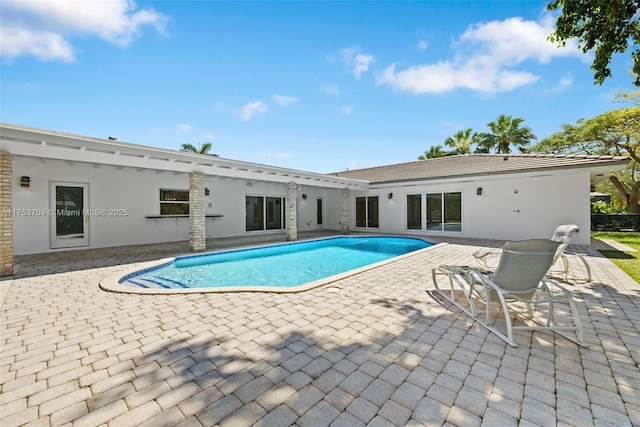 pool with a patio