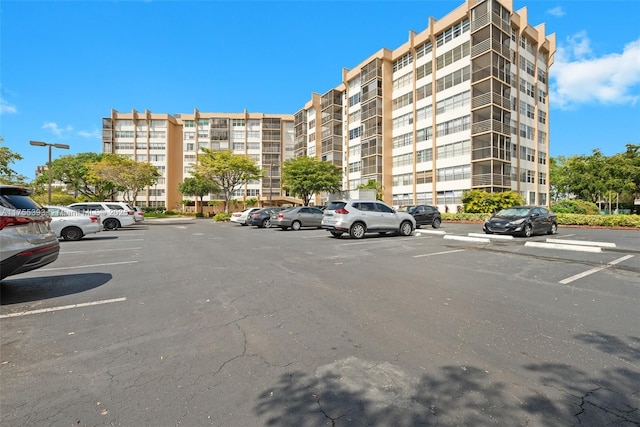 view of property featuring uncovered parking