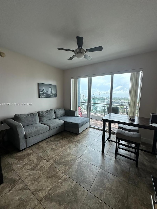 living area with a view of city and a ceiling fan