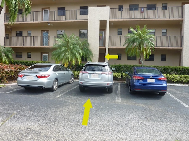 view of property with uncovered parking