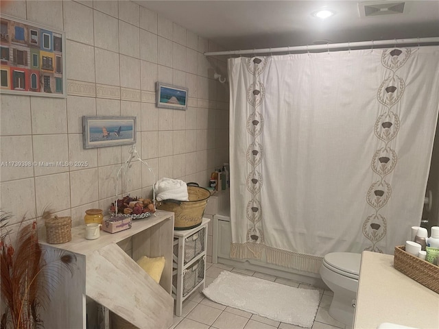 1121 Crandon Blvd Unit D404, Key Biscayne, FL 33149 - full bath with tile patterned floors, visible vents, toilet, tile walls, and shower / bath combination with curtain