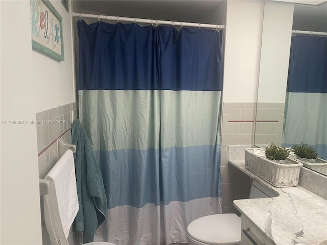 1121 Crandon Blvd Unit D404, Key Biscayne, FL 33149 - bathroom with toilet, tile walls, vanity, and a shower with curtain