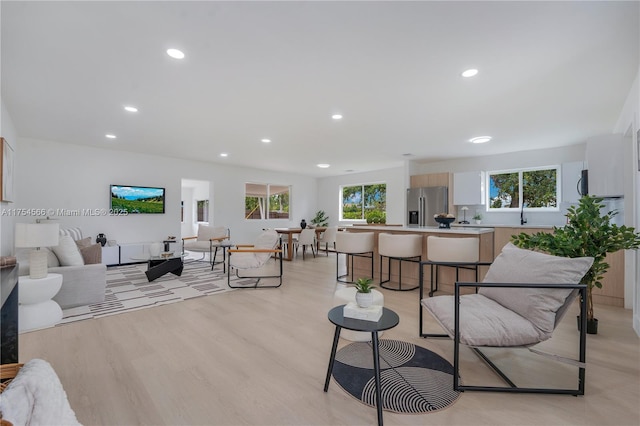 living room featuring light wood-style floors and recessed lighting