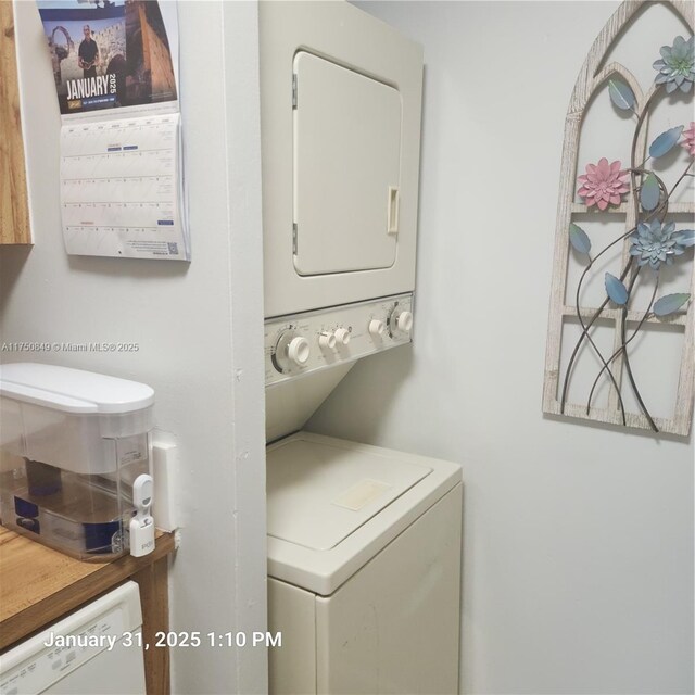 10004 Twin Lakes Dr Unit 36-F, Coral Springs, FL 33071 - laundry room featuring stacked washer and dryer and laundry area