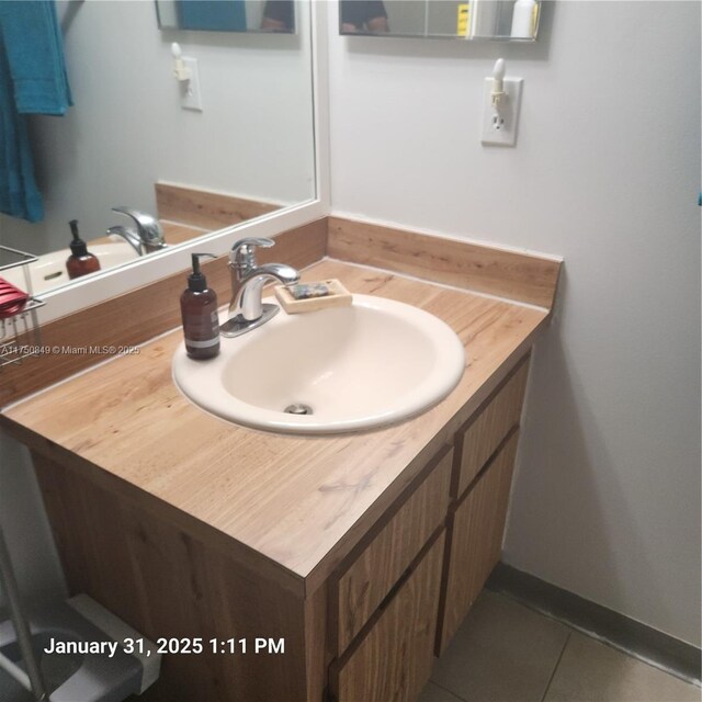 10004 Twin Lakes Dr Unit 36-F, Coral Springs, FL 33071 - bathroom featuring tile patterned flooring, vanity, and baseboards