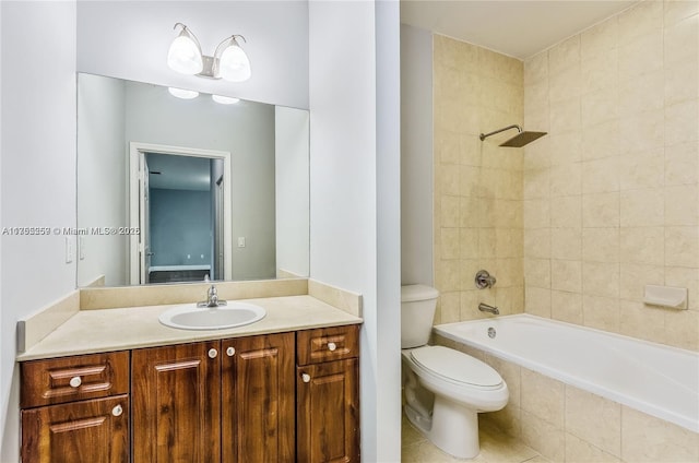 full bathroom with toilet, tile patterned floors, tiled shower / bath, and vanity