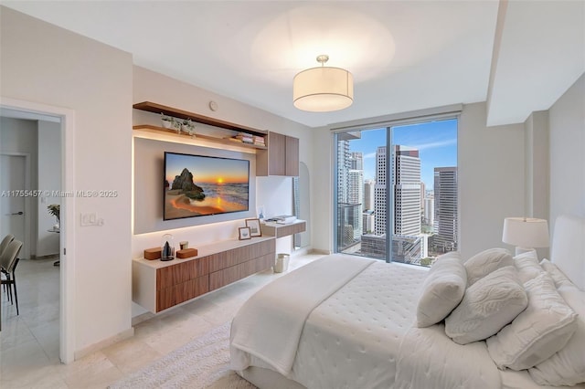 88 SW 7th St Unit 3003, Miami, FL 33130 - bedroom featuring baseboards and floor to ceiling windows