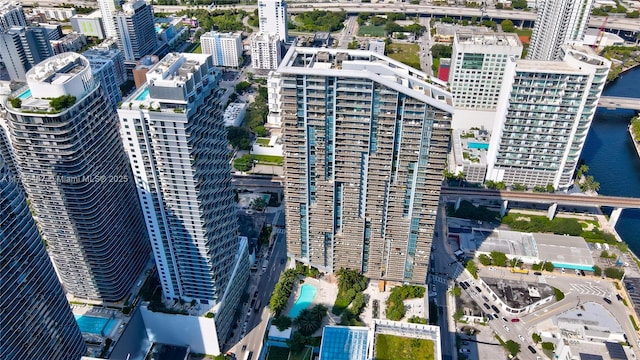 drone / aerial view featuring a water view and a city view