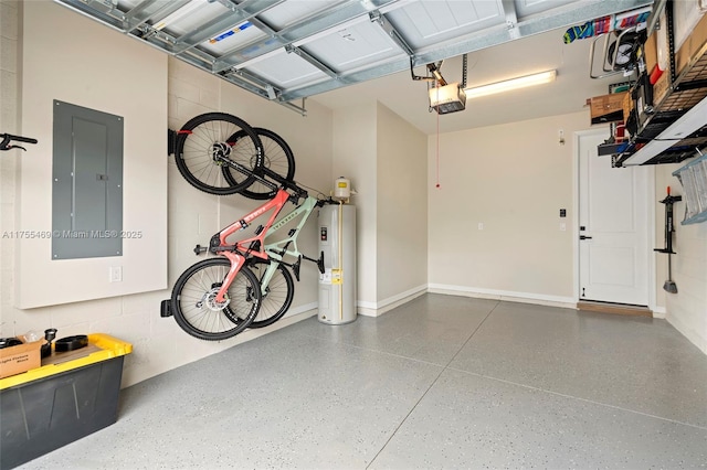 garage with baseboards, water heater, electric panel, a garage door opener, and concrete block wall