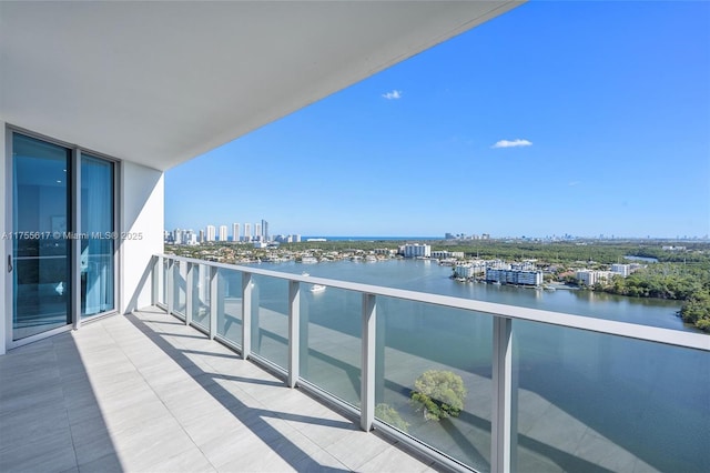 balcony featuring a view of city and a water view