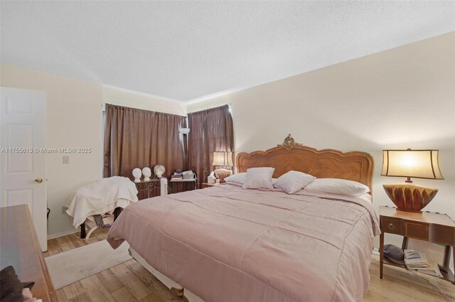 bedroom featuring light wood finished floors