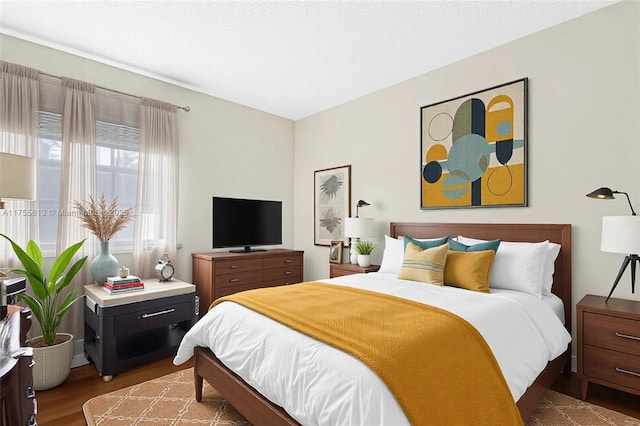 bedroom with wood finished floors