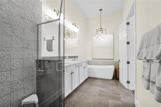 full bathroom with a stall shower, a soaking tub, and vanity