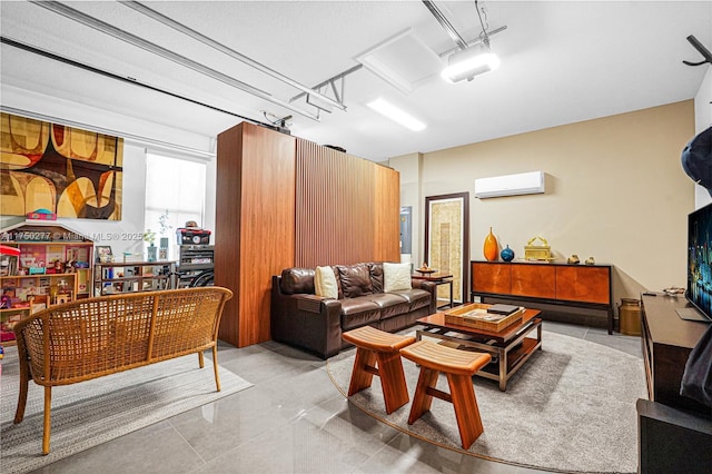 living room with a wall unit AC and a garage