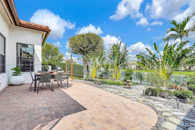 view of patio with outdoor dining area and a fenced backyard