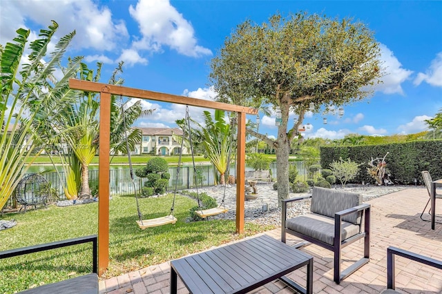 exterior space with a water view and a fenced backyard